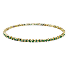 Bracelet tennis élastique à facettes avec émeraude en or jaune 750/18 carats